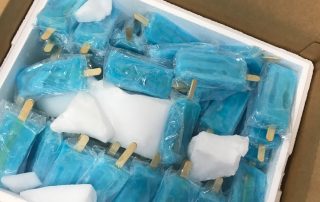 Blue popsicles in box